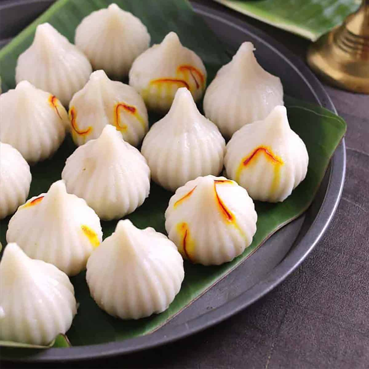 Saffron-topped ukadiche modak arranged for festive gifting